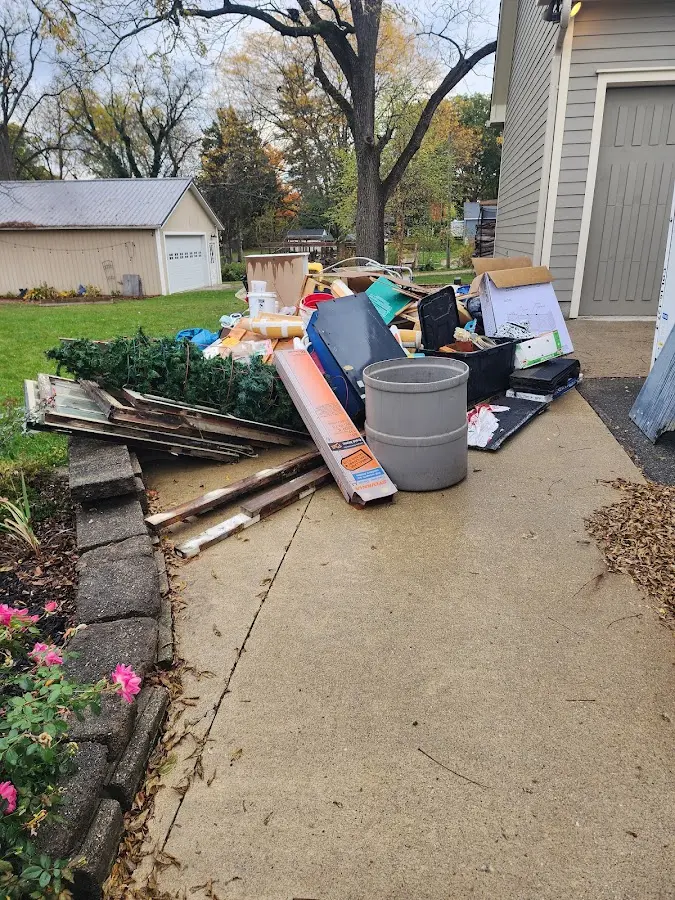 Dumpster being loaded with debris for Residential Dumpster Rental in Newark